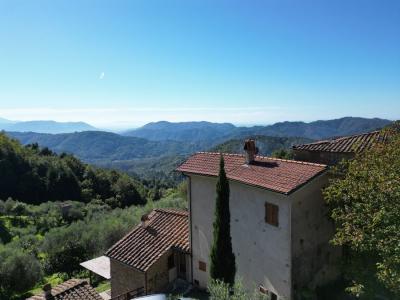 Two restored stone houses between Lucca and Camaiore