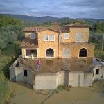 Unfinished farmhouse with olive grove