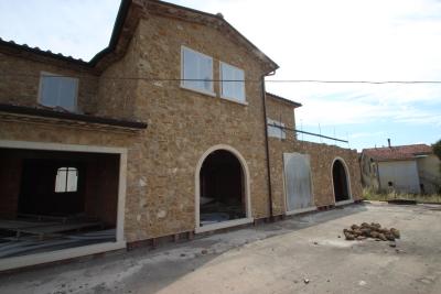 Unfinished farmhouse with olive grove