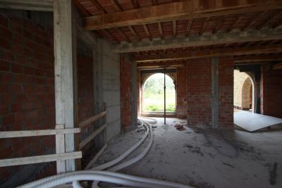 Unfinished farmhouse with olive grove